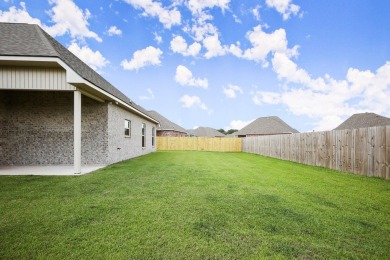 Situated in the prestigious Pelican Crossing subdivision on Pelican Point Golf Club in Louisiana - for sale on GolfHomes.com, golf home, golf lot