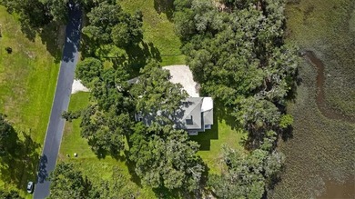 Introducing this exceptional 3,000-square-foot home in the on Sapelo Hammock Golf Club in Georgia - for sale on GolfHomes.com, golf home, golf lot