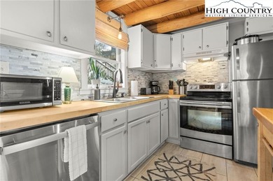 Turn-key, fully furnished mountain cabin just steps from the ski on Sugar Mountain Golf Course in North Carolina - for sale on GolfHomes.com, golf home, golf lot