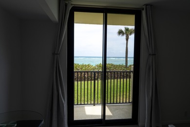 This spacious ocean end unit offers direct ocean views from its on Jupiter Dunes Golf Course in Florida - for sale on GolfHomes.com, golf home, golf lot