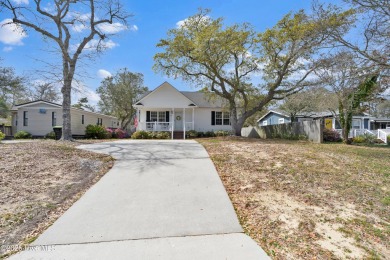 Imagine stepping into a charming getaway on Oak Island, NC on Founders Club At St. James Plantation in North Carolina - for sale on GolfHomes.com, golf home, golf lot