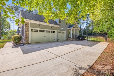 Located on a picturesque, park-like lot, this beautiful custom on Westport Golf Club in North Carolina - for sale on GolfHomes.com, golf home, golf lot