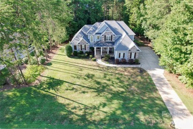 Located on a picturesque, park-like lot, this beautiful custom on Westport Golf Club in North Carolina - for sale on GolfHomes.com, golf home, golf lot