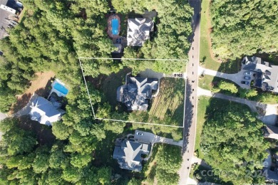 Located on a picturesque, park-like lot, this beautiful custom on Westport Golf Club in North Carolina - for sale on GolfHomes.com, golf home, golf lot