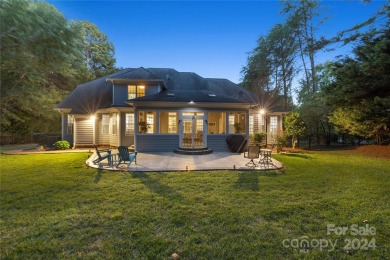 Located on a picturesque, park-like lot, this beautiful custom on Westport Golf Club in North Carolina - for sale on GolfHomes.com, golf home, golf lot