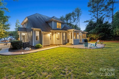 Located on a picturesque, park-like lot, this beautiful custom on Westport Golf Club in North Carolina - for sale on GolfHomes.com, golf home, golf lot