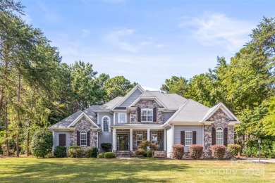 Located on a picturesque, park-like lot, this beautiful custom on Westport Golf Club in North Carolina - for sale on GolfHomes.com, golf home, golf lot