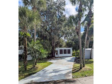 Check out this beautifully shaded RV lot with 240 sq.ft on The Great Outdoors Golf and Country Club in Florida - for sale on GolfHomes.com, golf home, golf lot