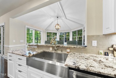 Welcome to an extraordinary home tucked away on a quiet on Hasentree Club in North Carolina - for sale on GolfHomes.com, golf home, golf lot