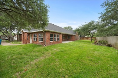 Tucked away in the Rockport Country Club, under the shade of oak on Rockport Country Club in Texas - for sale on GolfHomes.com, golf home, golf lot