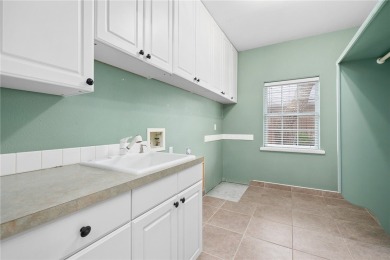 Tucked away in the Rockport Country Club, under the shade of oak on Rockport Country Club in Texas - for sale on GolfHomes.com, golf home, golf lot