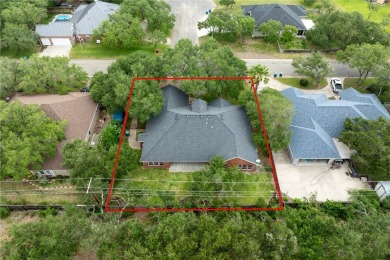 Tucked away in the Rockport Country Club, under the shade of oak on Rockport Country Club in Texas - for sale on GolfHomes.com, golf home, golf lot