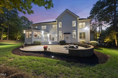 Welcome to an extraordinary home tucked away on a quiet on Hasentree Club in North Carolina - for sale on GolfHomes.com, golf home, golf lot