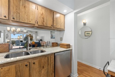 Live the Florida dream in your new move-in ready corner unit on Isla Del Sol Yacht and Country Club in Florida - for sale on GolfHomes.com, golf home, golf lot