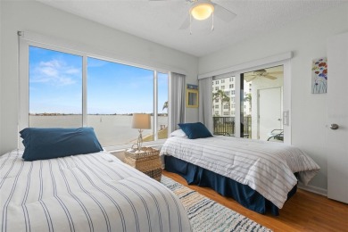 Live the Florida dream in your new move-in ready corner unit on Isla Del Sol Yacht and Country Club in Florida - for sale on GolfHomes.com, golf home, golf lot