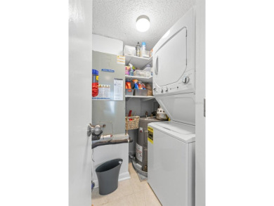 Live the Florida dream in your new move-in ready corner unit on Isla Del Sol Yacht and Country Club in Florida - for sale on GolfHomes.com, golf home, golf lot