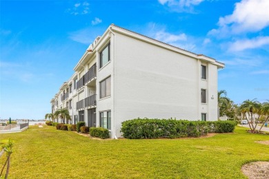 Live the Florida dream in your new move-in ready corner unit on Isla Del Sol Yacht and Country Club in Florida - for sale on GolfHomes.com, golf home, golf lot