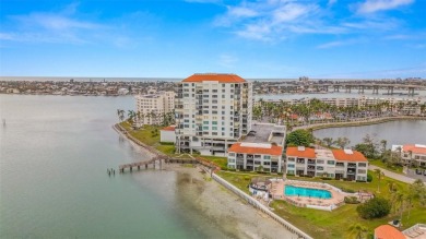 Live the Florida dream in your new move-in ready corner unit on Isla Del Sol Yacht and Country Club in Florida - for sale on GolfHomes.com, golf home, golf lot