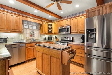Welcome Home to this adorable home with a sweet cottage vibe on Carolina Trace Country Club in North Carolina - for sale on GolfHomes.com, golf home, golf lot
