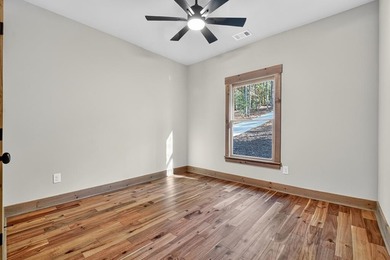 Overlooking a serene hidden lake--known by some residents as on White Path Golf Club in Georgia - for sale on GolfHomes.com, golf home, golf lot