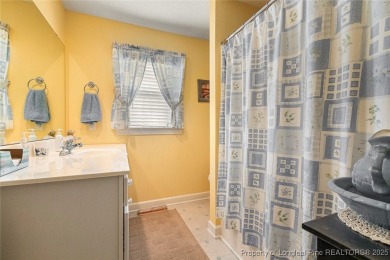 Welcome Home to this adorable home with a sweet cottage vibe on Carolina Trace Country Club in North Carolina - for sale on GolfHomes.com, golf home, golf lot