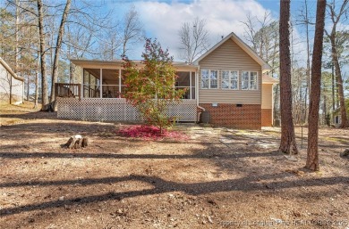 Welcome Home to this adorable home with a sweet cottage vibe on Carolina Trace Country Club in North Carolina - for sale on GolfHomes.com, golf home, golf lot
