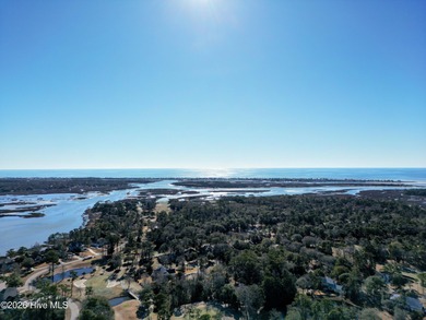 Set on more than half an acre, this surveyed and partially on Lockwood Folly Country Club in North Carolina - for sale on GolfHomes.com, golf home, golf lot