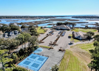 Set on more than half an acre, this surveyed and partially on Lockwood Folly Country Club in North Carolina - for sale on GolfHomes.com, golf home, golf lot