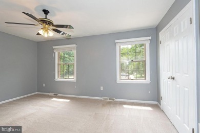 This spacious 3-level townhome is nestled in the sought-after on Bay Hills Golf Club in Maryland - for sale on GolfHomes.com, golf home, golf lot