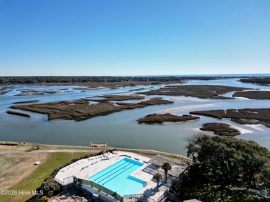 Set on more than half an acre, this surveyed and partially on Lockwood Folly Country Club in North Carolina - for sale on GolfHomes.com, golf home, golf lot