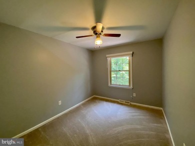 This spacious 3-level townhome is nestled in the sought-after on Bay Hills Golf Club in Maryland - for sale on GolfHomes.com, golf home, golf lot