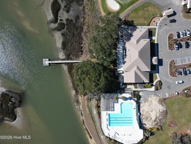 Set on more than half an acre, this surveyed and partially on Lockwood Folly Country Club in North Carolina - for sale on GolfHomes.com, golf home, golf lot