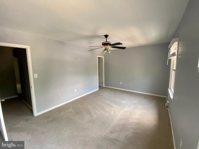 This spacious 3-level townhome is nestled in the sought-after on Bay Hills Golf Club in Maryland - for sale on GolfHomes.com, golf home, golf lot