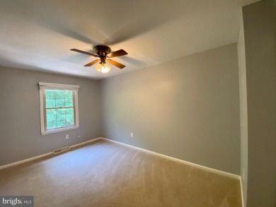 This spacious 3-level townhome is nestled in the sought-after on Bay Hills Golf Club in Maryland - for sale on GolfHomes.com, golf home, golf lot