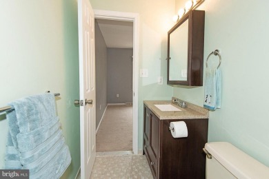 This spacious 3-level townhome is nestled in the sought-after on Bay Hills Golf Club in Maryland - for sale on GolfHomes.com, golf home, golf lot