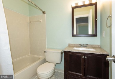 This spacious 3-level townhome is nestled in the sought-after on Bay Hills Golf Club in Maryland - for sale on GolfHomes.com, golf home, golf lot