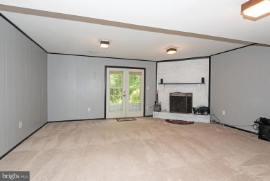 This spacious 3-level townhome is nestled in the sought-after on Bay Hills Golf Club in Maryland - for sale on GolfHomes.com, golf home, golf lot