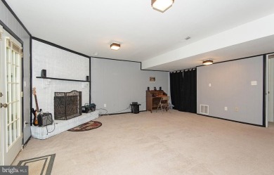 This spacious 3-level townhome is nestled in the sought-after on Bay Hills Golf Club in Maryland - for sale on GolfHomes.com, golf home, golf lot