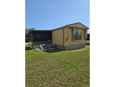 This home is located in the 55+ mobile home community of Anglers on Anglers Green Golf Course in Florida - for sale on GolfHomes.com, golf home, golf lot
