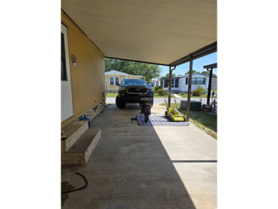 This home is located in the 55+ mobile home community of Anglers on Anglers Green Golf Course in Florida - for sale on GolfHomes.com, golf home, golf lot