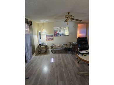 This home is located in the 55+ mobile home community of Anglers on Anglers Green Golf Course in Florida - for sale on GolfHomes.com, golf home, golf lot