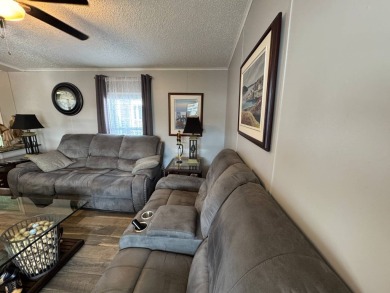 ***JUST REDUCED***This 2/2 1045 sq ft home is beautifully on Lake Henry Golf Club in Florida - for sale on GolfHomes.com, golf home, golf lot
