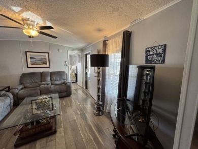 ***JUST REDUCED***This 2/2 1045 sq ft home is beautifully on Lake Henry Golf Club in Florida - for sale on GolfHomes.com, golf home, golf lot
