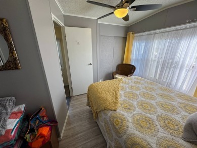 ***JUST REDUCED***This 2/2 1045 sq ft home is beautifully on Lake Henry Golf Club in Florida - for sale on GolfHomes.com, golf home, golf lot