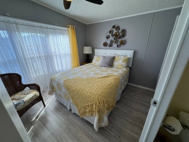 ***JUST REDUCED***This 2/2 1045 sq ft home is beautifully on Lake Henry Golf Club in Florida - for sale on GolfHomes.com, golf home, golf lot
