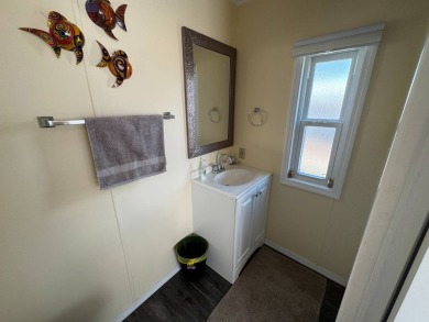 ***JUST REDUCED***This 2/2 1045 sq ft home is beautifully on Lake Henry Golf Club in Florida - for sale on GolfHomes.com, golf home, golf lot