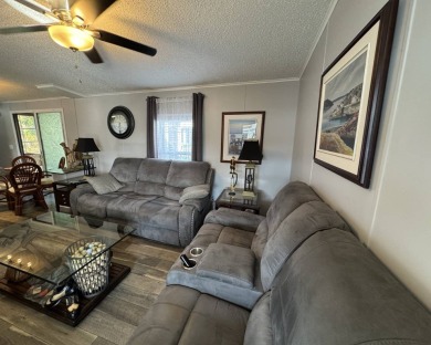 ***JUST REDUCED***This 2/2 1045 sq ft home is beautifully on Lake Henry Golf Club in Florida - for sale on GolfHomes.com, golf home, golf lot