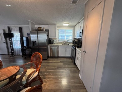 ***JUST REDUCED***This 2/2 1045 sq ft home is beautifully on Lake Henry Golf Club in Florida - for sale on GolfHomes.com, golf home, golf lot