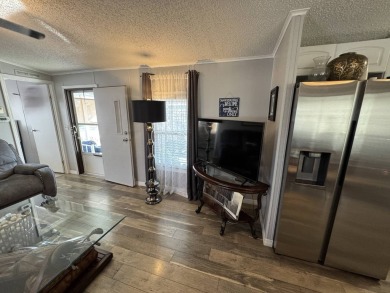 ***JUST REDUCED***This 2/2 1045 sq ft home is beautifully on Lake Henry Golf Club in Florida - for sale on GolfHomes.com, golf home, golf lot