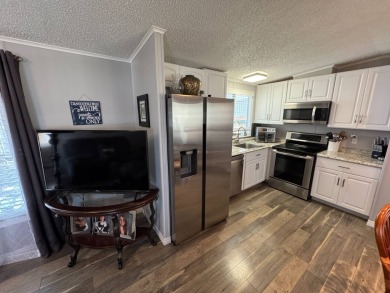 ***JUST REDUCED***This 2/2 1045 sq ft home is beautifully on Lake Henry Golf Club in Florida - for sale on GolfHomes.com, golf home, golf lot